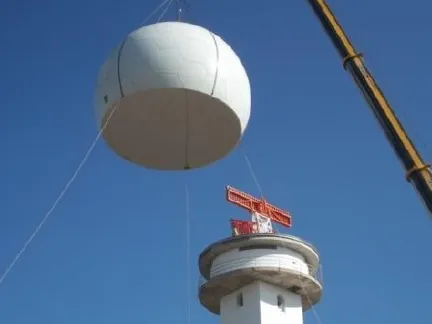 Radome Focus ATC radome being lifted onto a radar tower