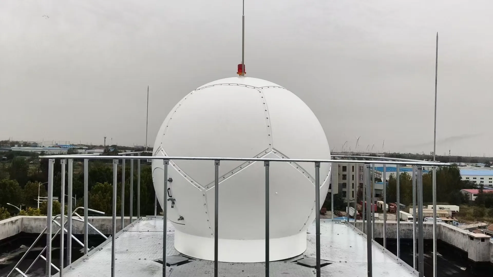 4.5 m panel radome installed on a rooftop platform with safety railings, lightning protection and obstruction light